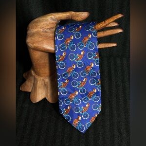 Fun Curious George on a bicycle men’s tie